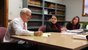 DRUG COURT DISCUSSION: Members of the Pulaski County Drug Court Team evaluate the progress of program participants at their December 18 meeting. Pictured are (from left) the Honorable Marcus H. Long, Jr., Probation Officer Dana Manns, and NRVCS’ Lori Trail, Coordinator of the Drug Court Program. (Photo - Mike Wade/NRVCS)